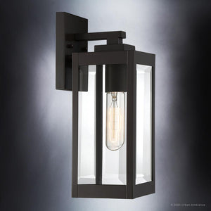 A beautiful lighting fixture, the Urban Ambiance UQL1350 Modern Farmhouse Outdoor Wall Light enhances outdoor spaces with its Estate Bronze Finish and clear glass bulb.