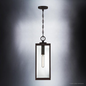 A gorgeous modern farmhouse outdoor pendant light with a glass shade from the Quincy Collection, featuring an estate bronze finish.