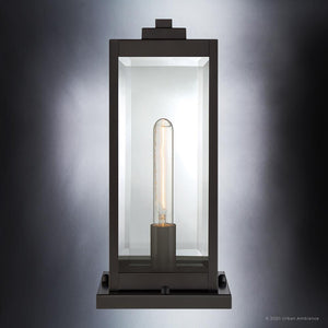The Urban Ambiance UQL1355 Modern Farmhouse Outdoor Pier Light from the Quincy Collection features a rectangular lantern-style design in an Estate Bronze finish, showcasing a visible tubular bulb inside. The 16-inch tall, 7.5-inch wide fixture is set against a gradient gray background, evoking the classic style of Quincy pier lights.
