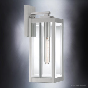 The Urban Ambiance UQL1361 Modern Farmhouse Outdoor Wall Light from the Quincy Collection features a rectangular stainless steel frame with clear beveled glass and a vertical exposed filament bulb, measuring 17″ high by 6″ wide.