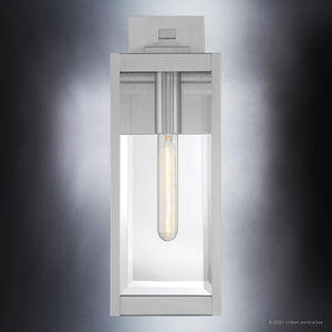 The Urban Ambiance UQL1361 Modern Farmhouse Outdoor Wall Light from the Quincy Collection features a rectangular design with a stainless steel finish, clear beveled glass panels, and a single exposed vertical bulb inside.