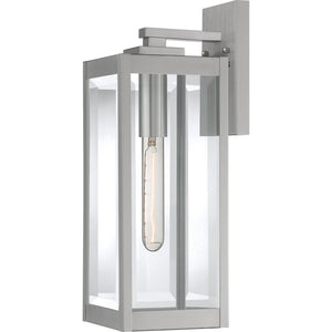Illuminate your exterior with the Urban Ambiance UQL1361 Modern Farmhouse Outdoor Wall Light from the Quincy Collection, featuring a 17″H x 6″W rectangular stainless steel frame, clear beveled glass enclosure, and a visible vertical bulb for a stylish modern farmhouse appeal.