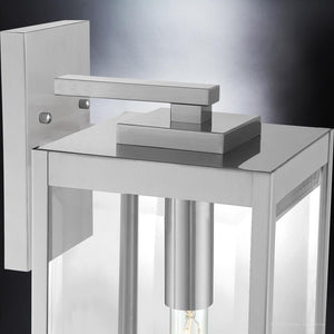 A beautiful outdoor wall lamp with a stainless steel finish and glass shade from the Quincy Collection by Urban Ambiance.