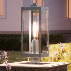 An Urban Ambiance UQL1363 Modern Farmhouse Outdoor Pier Light, 20.5"H x 7"W, Stainless Steel Finish, Quincy Collection with a lamp on it.