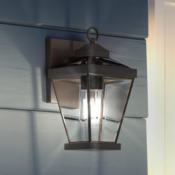 A beautiful black UQL1403 Casual Outdoor Wall Light with a light on it by Urban Ambiance.