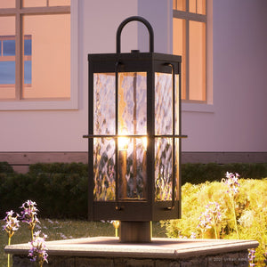 A unique lighting fixture, the UQL1460 Ultilitarian Outdoor Post/Pier Light, adds a gorgeous touch to any space with its Urban Ambiance lantern and Urban Bronze Finish from the Parma