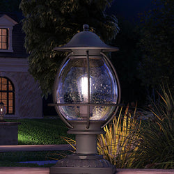 An Urban Ambiance UQL1470 Craftsman Outdoor Post/Pier Light, 18.75"H x 10.5"W, beautiful black sand finish lamp from the Hammond Collection in the distance