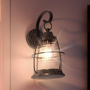 A beautiful UQL1542 Nautical Outdoor Wall Light from the Urban Ambiance Danbury Collection, featuring a luxury lantern hanging on it, with a Black Sand Finish.