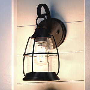 A unique and gorgeous UQL1543 Nautical Outdoor Wall Light, 12.25"H x 6"W, with a Black Sand Finish, from the Danbury Collection by Urban Amb
