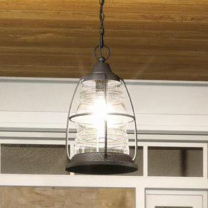 A unique pendant lamp, the Urban Ambiance UQL1544 Nautical Outdoor Pendant Light, with a Black Sand Finish from the Danbury Collection, is hanging over a porch.