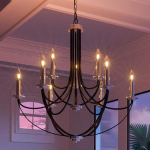 An Urban Ambiance Marseille Collection chandelier lighting fixture hanging in a room with a beautiful view of the ocean.