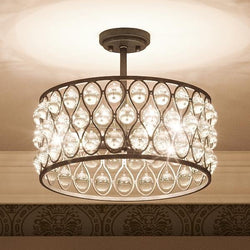 An Urban Ambiance UQL2024 Crystal Semi-Flush Ceiling Light, 11.75"H x 16"W, Parisian Bronze Finish, Sienna Collection with a unique crystal ball centerpiece.