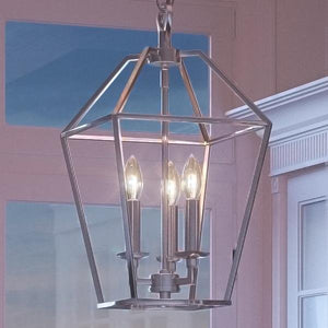 A gorgeous Colonial Chandelier, 17"H x 9.5"W, from the Charleston Collection hanging over a window in a room.