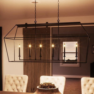 A dining room with a gorgeous Urban Ambiance UQL2067 Colonial Chandelier hanging over the table.