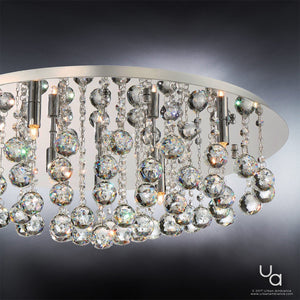 The Urban Ambiance UQL2081 Traditional Flush Mount Ceiling Light from the Manhattan Collection features a polished chrome finish and a metallic circular base. Measuring 9 inches high by 19.75 inches wide, this fixture showcases hanging crystal spheres and glass beads that reflect light from multiple small bulbs, adding contemporary elegance to any space.