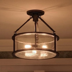 A unique Urban Ambiance UQL2133 lighting fixture with a round glass shade.