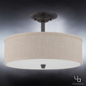 Introduce a modern farmhouse touch to any space with the Urban Ambiance UQL2231 Modern Farmhouse Semi-Flush Ceiling Light from the Dublin Collection. This ceiling-mounted fixture features a round khaki fabric drum shade, a dark bronze metal stem, and a frosted glass diffuser, beautifully photographed against a neutral background—perfect for adding stylish ceiling lighting at 12″ high by 17″ wide.