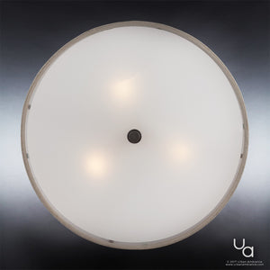 The Urban Ambiance UQL2231 Modern Farmhouse Semi-Flush Ceiling Light from the Dublin Collection features a bronze finish, a khaki fabric drum shade with frosted glass cover, and is illuminated by three bulbs—measuring 12″ high by 17″ wide. Viewed from below against a gradient backdrop, this ceiling fixture adds warmth and stylish modern farmhouse appeal to your space.