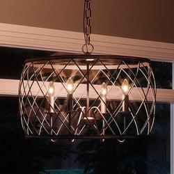 A gorgeous French Country chandelier from the York Collection by Urban Ambiance hanging over a window.