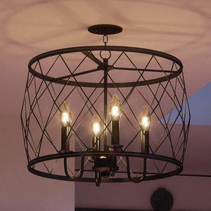An UQL2263 French Country Chandelier with four unique lights, creating a gorgeous urban ambiance.