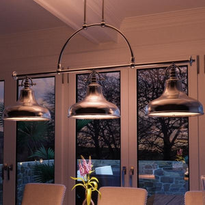 A dining room with a beautiful UQL2283 Industrial Chandelier from Urban Ambiance.
