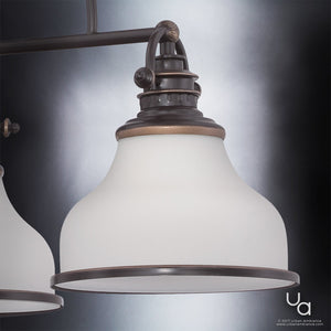 Close-up of the Urban Ambiance UQL2332 Industrial Chandelier from the Pasadena Collection, showcasing a Parisian Bronze finish with dark bronze and brass accents, and a frosted glass shade—an elegant fixture measuring 15.5″H x 24″W set against a neutral background.