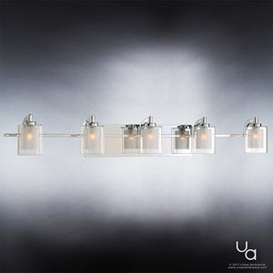The Urban Ambiance UQL2407 Modern Bathroom Vanity Light from the Napa Collection features a polished chrome finish and five cylindrical frosted glass shades, all illuminated and displayed against a gradient gray background. Measuring 6 inches high by 42 inches wide, this sophisticated dual-layered glass fixture is ideal for modern bathroom lighting. Urban Ambiance logo appears in the bottom right corner.
