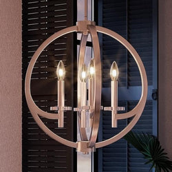 An unique UQL2550 Globe Chandelier, 19.5"H x 18"W, Brushed Nickel Finish from the Denver Collection by Urban Ambiance hanging over a window.