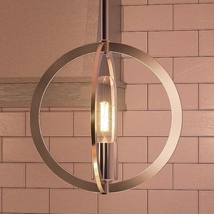 An Urban Ambiance UQL2554 Globe Pendant is a gorgeous lighting fixture hanging over a tiled kitchen.