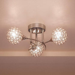 A unique and luxury lamp, the Urban Ambiance UQL2633 Crystal Globe Globe Semi-Flush Ceiling Light showcases a chrome finish and three glass balls from its Rome Collection.