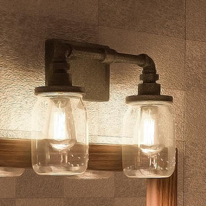 Two UQL2661 Industrial Bathroom Lights, 11"H x 14"W, Antique Black Finish from the Dallas Collection by Urban Ambiance hanging on a wall. (unique and gorgeous)