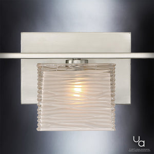 The Urban Ambiance UQL2722 Modern Bathroom Light from the San Diego Collection features a wavy glass shade and brushed nickel backplate, measuring 6.75 inches in height and 22.5 inches wide, for a contemporary look illuminated by an interior bulb.