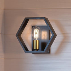 An UQL2773 Industrial Wall Sconce, 8.75"H x 10"W lighting fixture with a bulb in it.