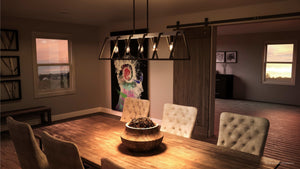 An urban dining room with a beautiful lighting fixture: the Urban Ambiance UQL2811 Industrial Chandelier in an Ash Black Finish, complemented by the luxury of a Bergen Collection table and chairs.