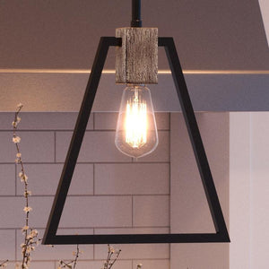 A unique UQL2812 Industrial Pendant, with a triangle shape hanging above a kitchen counter.