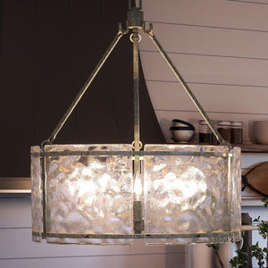 A unique UQL2872 Industrial Chandelier, 23.5"H x 20.5"W, Silver Etch Finish from the Nantes Collection by Urban Ambiance hanging over a kitchen counter