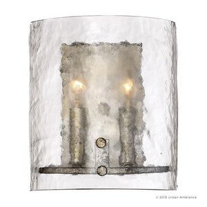 The UQL2873 Industrial Wall Sconce from the Nantes Collection by Urban Ambiance features two faux candle bulbs, a curved clear glass shade, and a metallic silver etch base. Shown illuminated and photographed from the front, it measures 10″ high by 8.75″ wide.