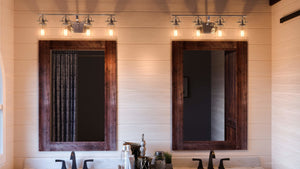 A bathroom with two sinks and two mirrors featuring Urban Ambiance's UQL2882 Industrial Bathroom Vanity Light, 9.5
