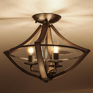 An inviting ceiling light from the Urban Ambiance Swansea Collection, the UQL2963 Farmhouse Ceiling fixture features a 12.5-inch height and 16.5-inch width, crafted with wood grain metal and an antique black finish. Mounted on a textured white ceiling, it adds warmth and character to the space.