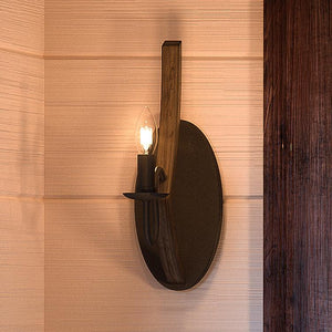 A gorgeous Urban Ambiance UQL2964 Farmhouse Wall Sconce with a beautiful candle.