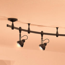 A unique Urban Ambiance UQL3010 Modern Track Light, 11.5"H x 5"W, Estate Bronze Finish, Perth Collection fixture with three lights on it.