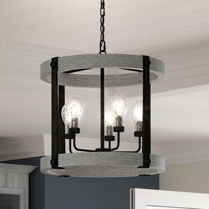 A beautiful Urban Ambiance UQL3262 Minimalist Chandelier, 21"H x 21"W, Ash Black Finish, Murrieta Collection hanging over a dining room table.