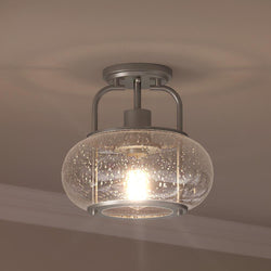 A beautiful lighting fixture with a glass globe in it.