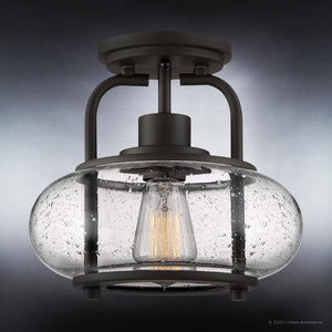 The UQL3271 Utilitarian Ceiling Light by Urban Ambiance, from the Clearwater Collection, features an oversized clear seedy glass shade and vintage bulbs. Measuring 9.28