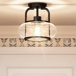 A unique UQL3271 Utilitarian Ceiling Light with a glass shade and a floral pattern.