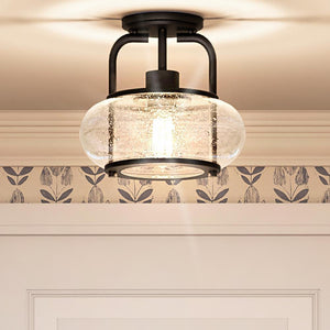A unique UQL3271 Utilitarian Ceiling Light with a glass shade and a floral pattern.