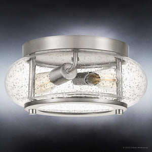The Urban Ambiance UQL3290 Utilitarian Ceiling Light from the Clearwater Collection features a brushed nickel finish and measures 5.75 inches high by 12 inches wide. With two exposed bulbs encased in clear bubbled glass, this modern farmhouse ceiling fixture offers a distinctive seeded-glass look that brings both style and warmth to any space.