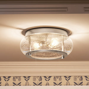 A beautiful Urban Ambiance ceiling light with a unique UQL3290 Utilitarian Ceiling Light, 5.75"H x 12"W, Brushed Nickel Finish, Clearwater Collection round