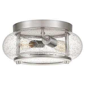 Introducing the UQL3290 Utilitarian Ceiling Light from Urban Ambiance’s Clearwater Collection, this modern farmhouse fixture features a brushed nickel finish with two visible bulbs enclosed in a round, clear seeded glass shade and sleek metal accents. Measuring 5.75 inches high by 12 inches wide, the seeded glass design enhances its timeless appeal, while the brushed nickel finish adds contemporary elegance and charm to any space.