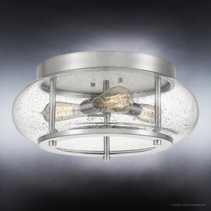 The Urban Ambiance UQL3300 Utilitarian Ceiling Light from the Clearwater Collection features a sleek round brushed nickel frame and a clear seeded glass shade showcasing two exposed Edison bulbs. Measuring 7 inches high by 16 inches wide, this stylish flush mount brightens any room with warm, inviting light.